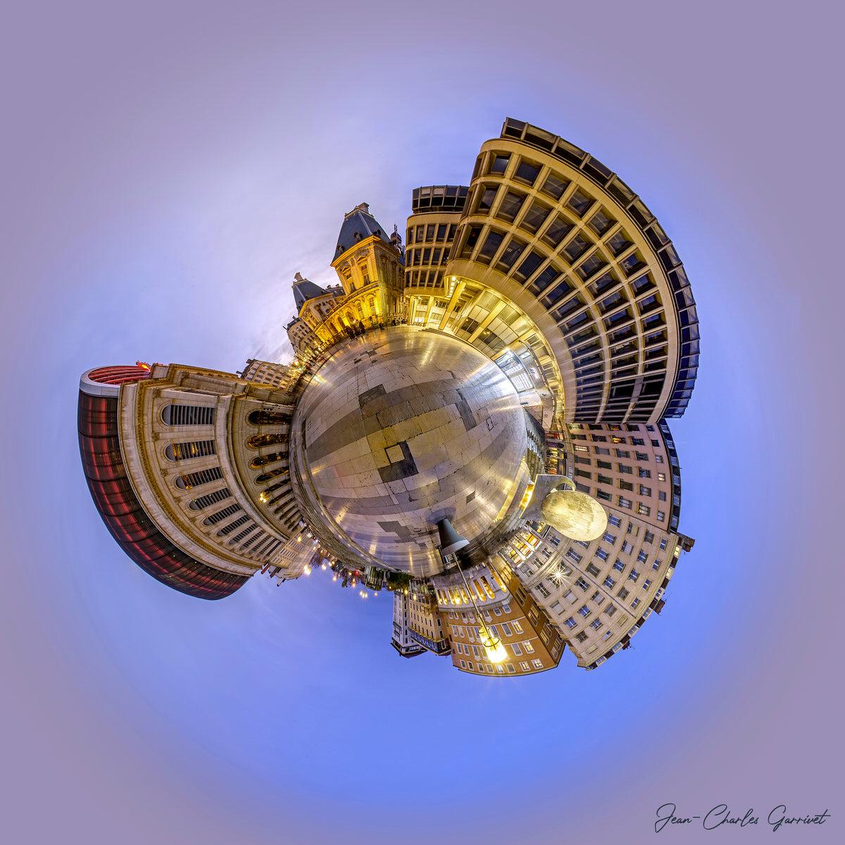 Spherical cityscape with illuminated buildings against a blue sky