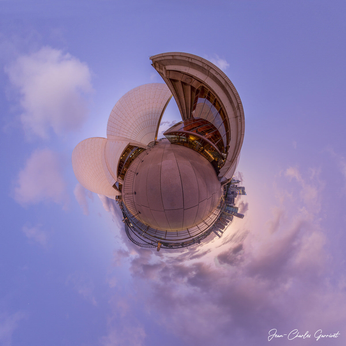 Spherical view of a building with a blue sky and clouds