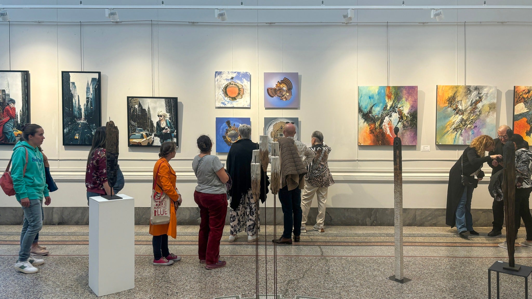Little Big World exhibition by Jean-Charles Garrivet at Regain Art Lyon, with visitors viewing creative fine art photography artworks in a contemporary gallery.
