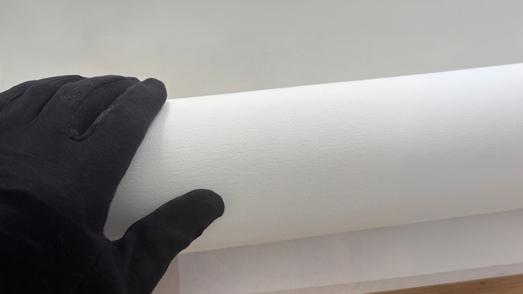 Little Big World print process by Jean-Charles Garrivet, showing the texture of Hahnemühle fine art paper during the artwork unboxing.