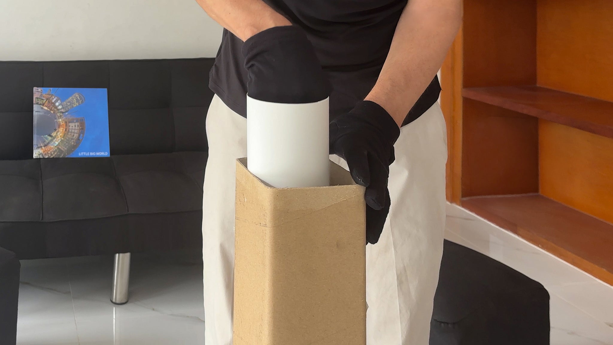 Little Big World print process by Jean-Charles Garrivet, showing the careful unboxing of the protective artwork tube after receiving a fine art photography print.